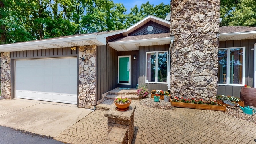 43375 Hunt Club Road Zion, IL 60099 - Photo 2 of 56 a front view of a house with patio