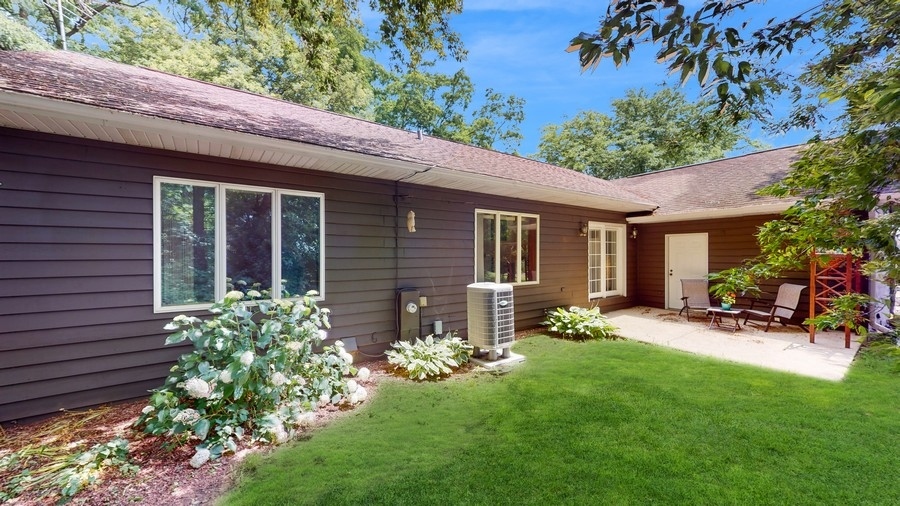 43375 Hunt Club Road Zion, IL 60099 - Photo 22 of 56 a view of a chair and table in front of house