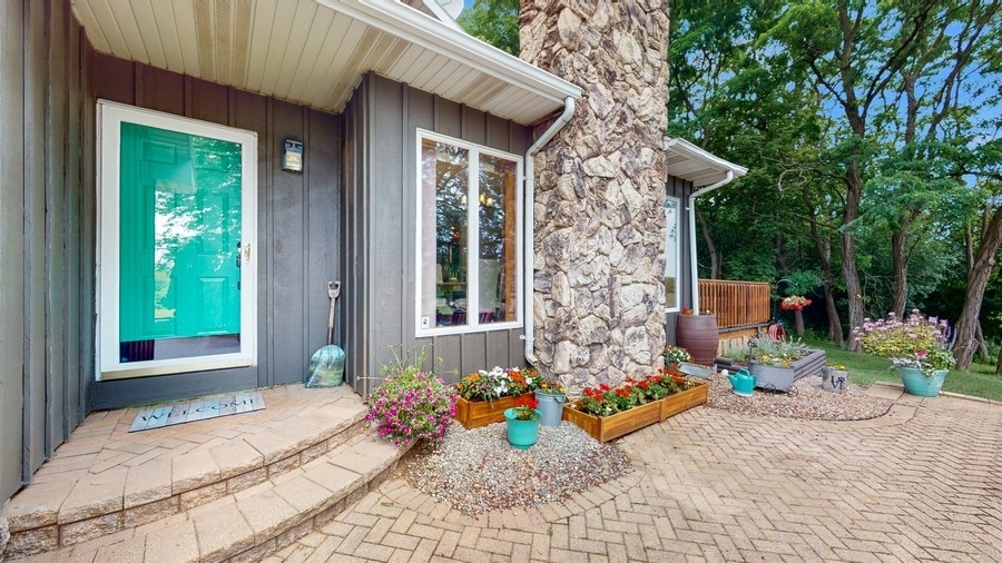 43375 Hunt Club Road Zion, IL 60099 - Photo 25 of 56 a front view of a house with patio