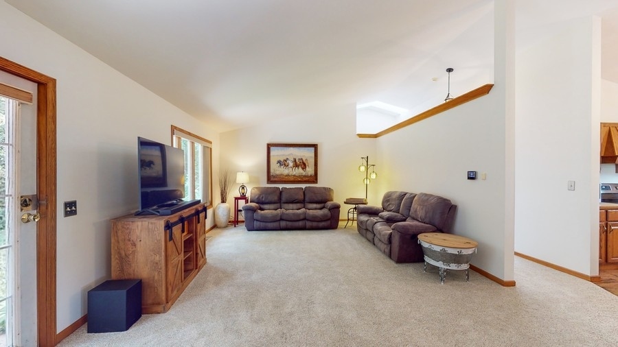 43375 Hunt Club Road Zion, IL 60099 - Photo 3 of 56 a living room with furniture and a flat screen tv