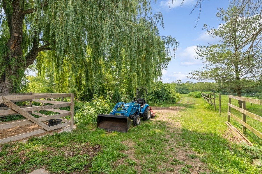 43375 Hunt Club Road Zion, IL 60099 - Photo 31 of 56 a view of a garden with lawn chairs and a fire pit