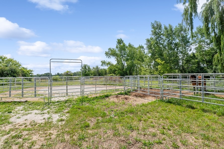 43375 Hunt Club Road Zion, IL 60099 - Photo 32 of 56 a view of a garden with a wooden fence