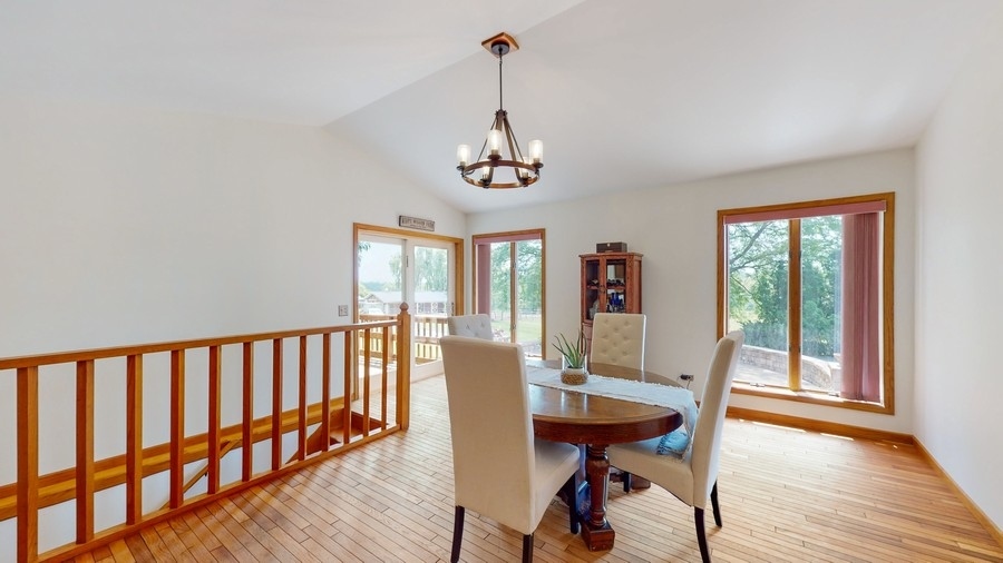 43375 Hunt Club Road Zion, IL 60099 - Photo 8 of 56 a view of a dining room with furniture window and wooden floor