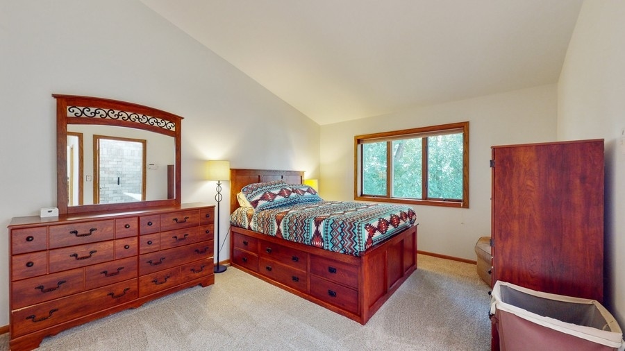 43375 Hunt Club Road Zion, IL 60099 - Photo 10 of 56 a bedroom with a bed and a dresser