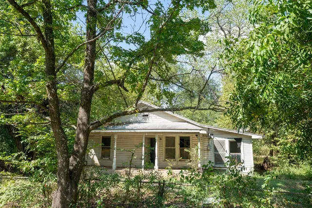 front view of house with a tree