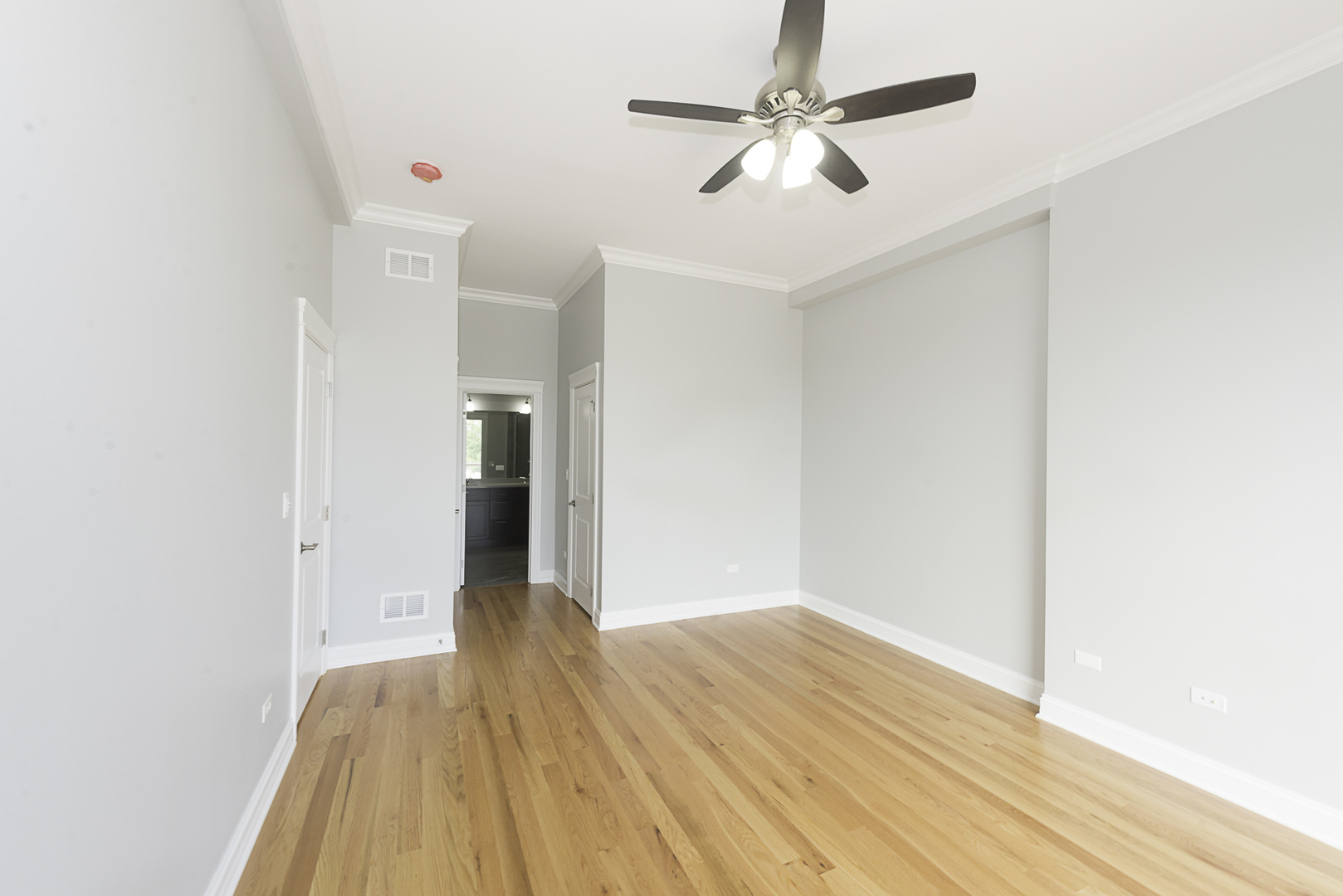 520 North Western Avenue, Unit 4B Chicago, IL 60612 - Photo 17 of 35 a view of a room with wooden floor and ceiling fan