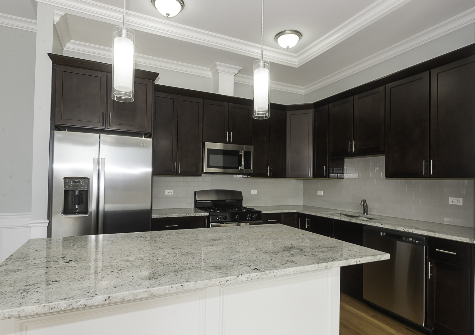 520 North Western Avenue, Unit 4B Chicago, IL 60612 - Photo 2 of 35 a kitchen with stainless steel appliances granite countertop a sink a stove and a refrigerator
