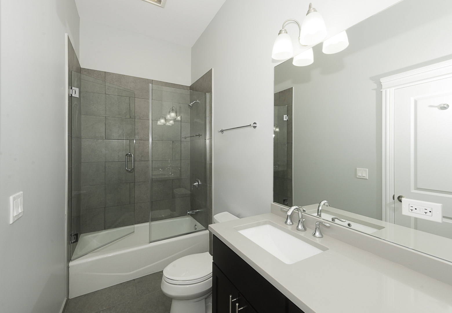520 North Western Avenue, Unit 4B Chicago, IL 60612 - Photo 22 of 35 a bathroom with a sink a toilet and shower