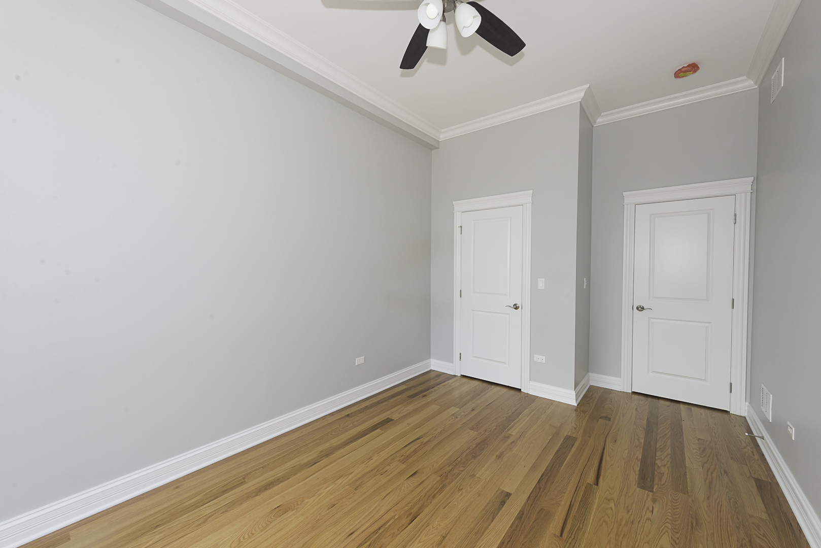 520 North Western Avenue, Unit 4B Chicago, IL 60612 - Photo 24 of 35 a view of room with wooden floor and ceiling fan