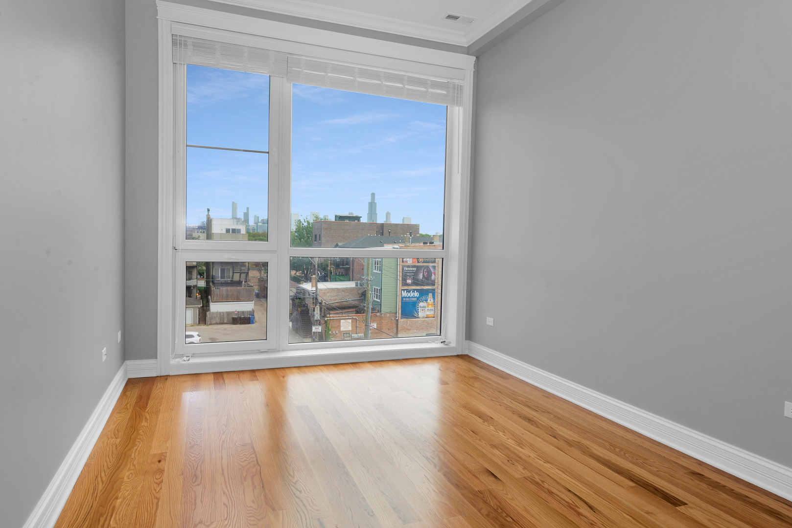 520 North Western Avenue, Unit 4B Chicago, IL 60612 - Photo 27 of 35 a view of a room with wooden floor and a window