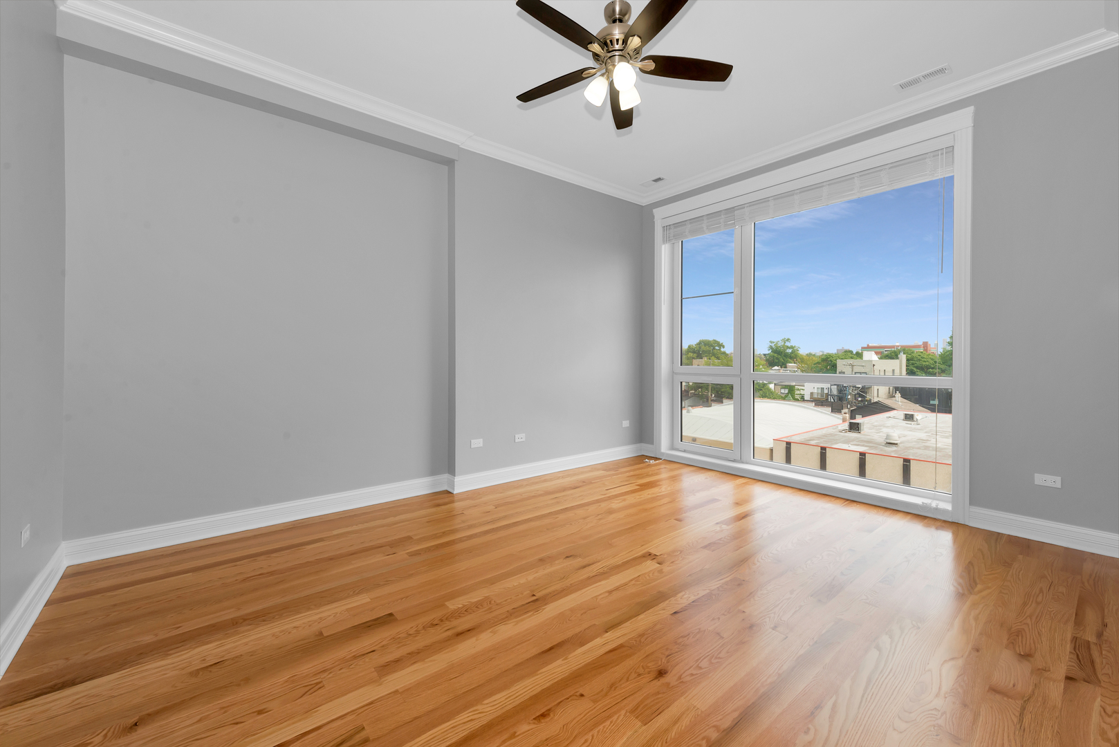 520 North Western Avenue, Unit 4B Chicago, IL 60612 - Photo 30 of 35 a view of an empty room with a window and wooden floor