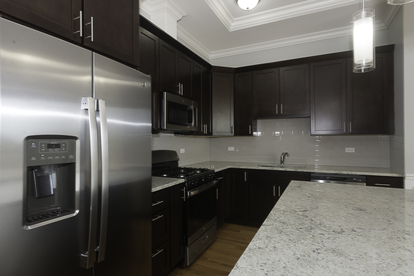 520 North Western Avenue, Unit 4B Chicago, IL 60612 - Photo 3 of 35 a kitchen with a refrigerator sink and cabinets