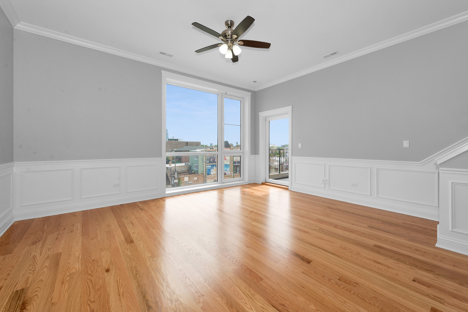 520 North Western Avenue, Unit 4B Chicago, IL 60612 - Photo 35 of 35 a view of a livingroom with a hardwood floor and a ceiling fan