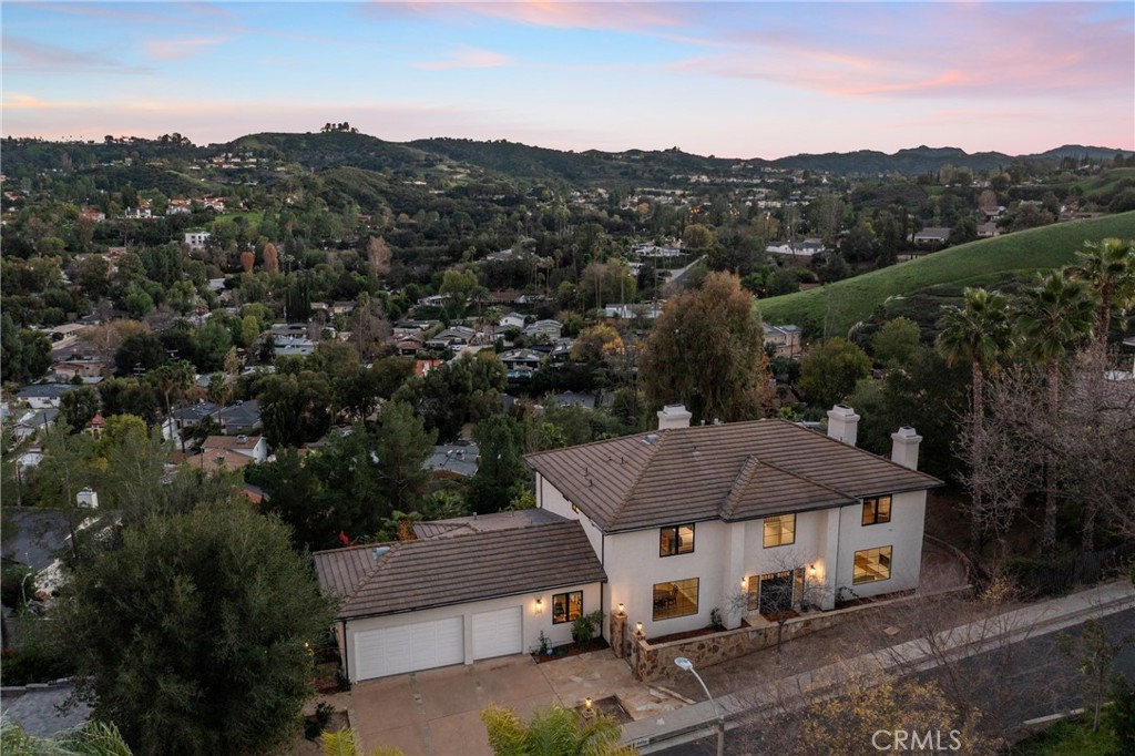 an aerial view of a house with mountain view