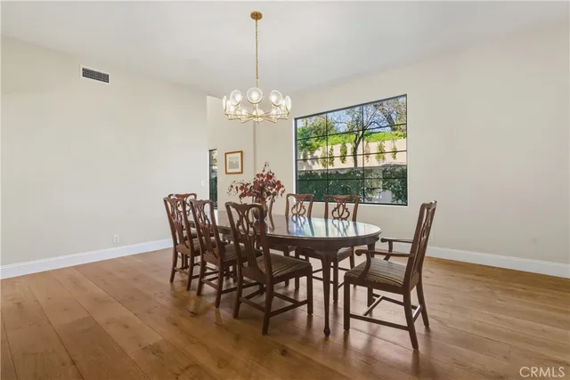a spacious bedroom with a large bed and a fireplace