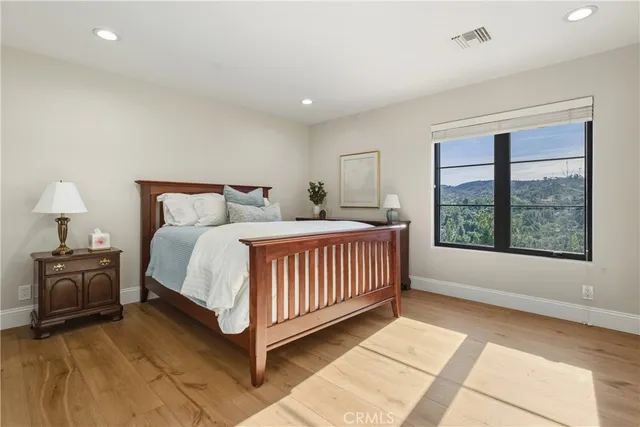 a park view with a bench in the patio