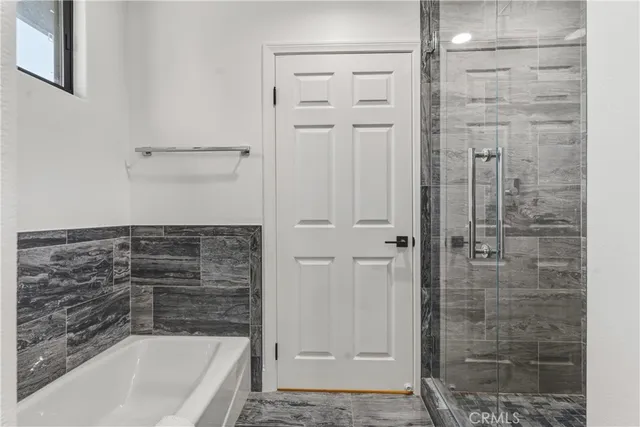 a view of a town with mountains in the background