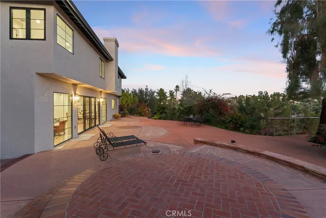an aerial view of a houses with outdoor space and garden