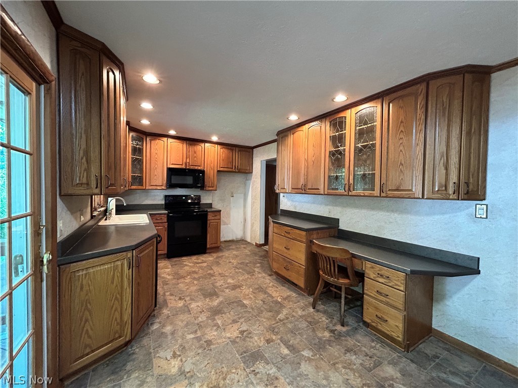 443 Lansing Road Akron, OH 44312 - Photo 10 of 29 Spacious Kitchen offers lots of counter space and Merillat oak cabinetry