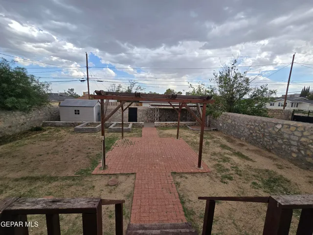 a view of a terrace with wooden fence