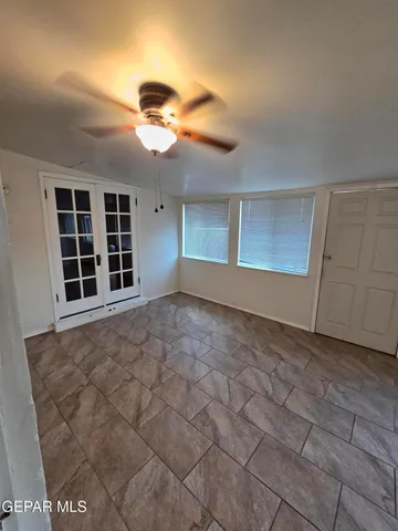 a view of empty room with windows