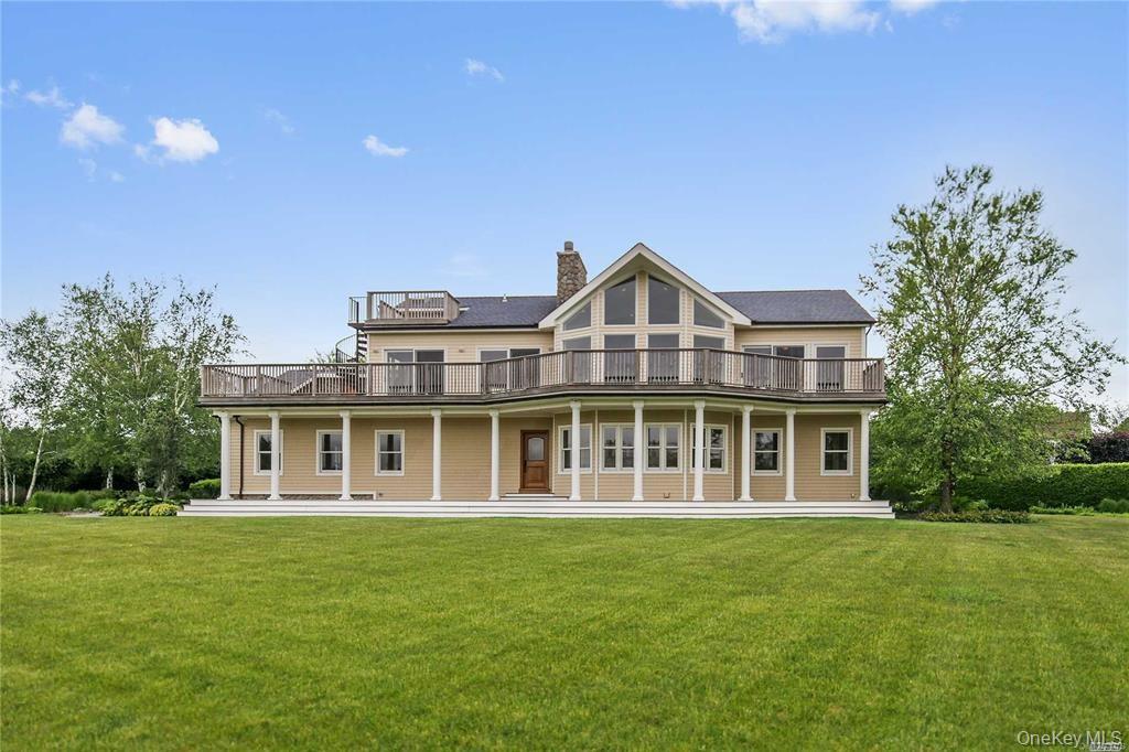 1680 Lands End Road Orient, NY 11957 - Photo 6 of 50 Back of Home and Backyard in Summer