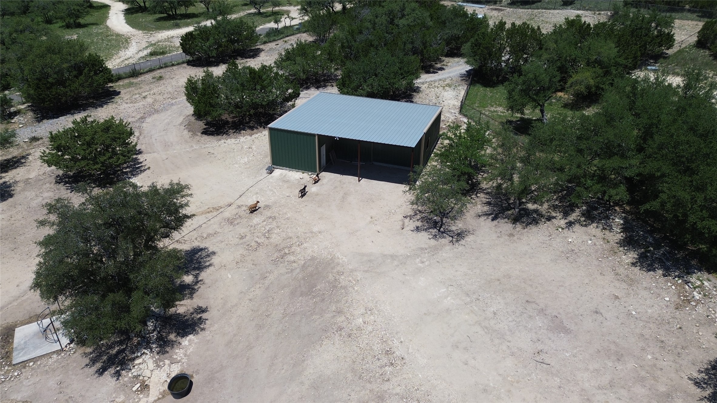 496 Middleton Road Spicewood, TX 78669 - Photo 39 of 40 A spacious barn on a sprawling rural lot, ideal for agricultural pursuits or storage.