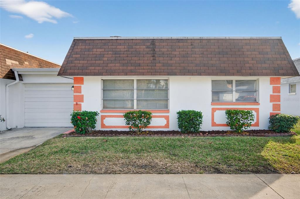 a front view of house with yard