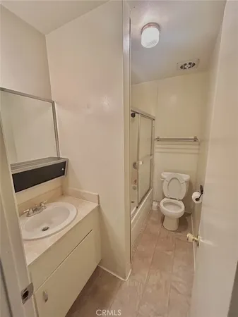 a bathroom with a sink toilet and vanity