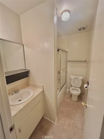 a bathroom with a sink toilet and vanity