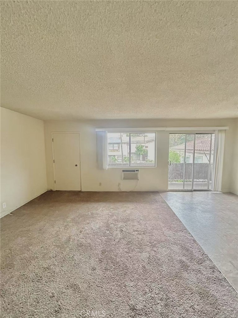 922 West Duarte Road, Unit 11 Arcadia, CA 91007 - Photo 8 of 17 an empty room with windows