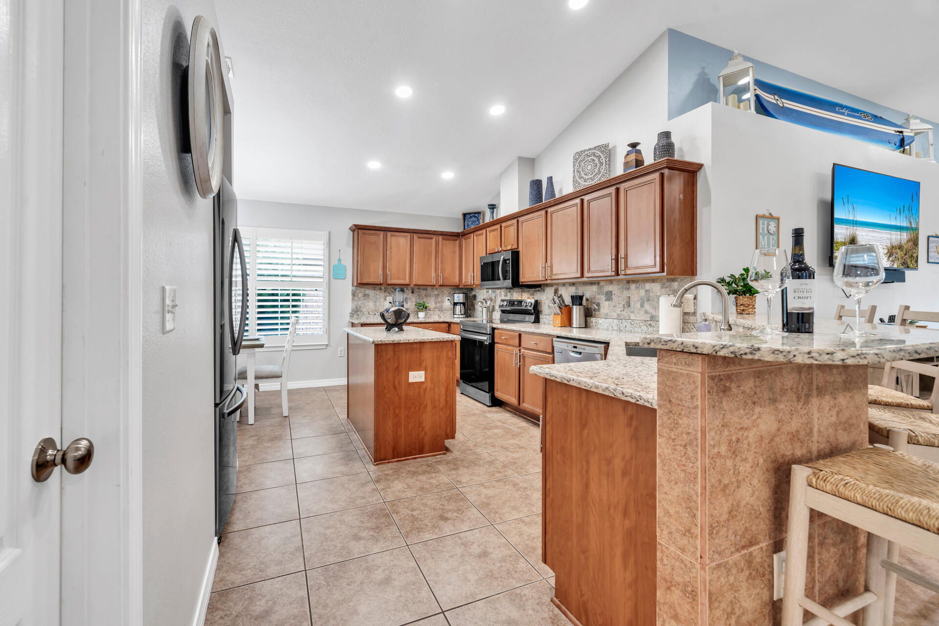 261 Sandy Cay Drive Miramar Beach, FL 32550 - Photo 14 of 72 a kitchen with stainless steel appliances granite countertop a stove a sink a refrigerator and a refrigerator