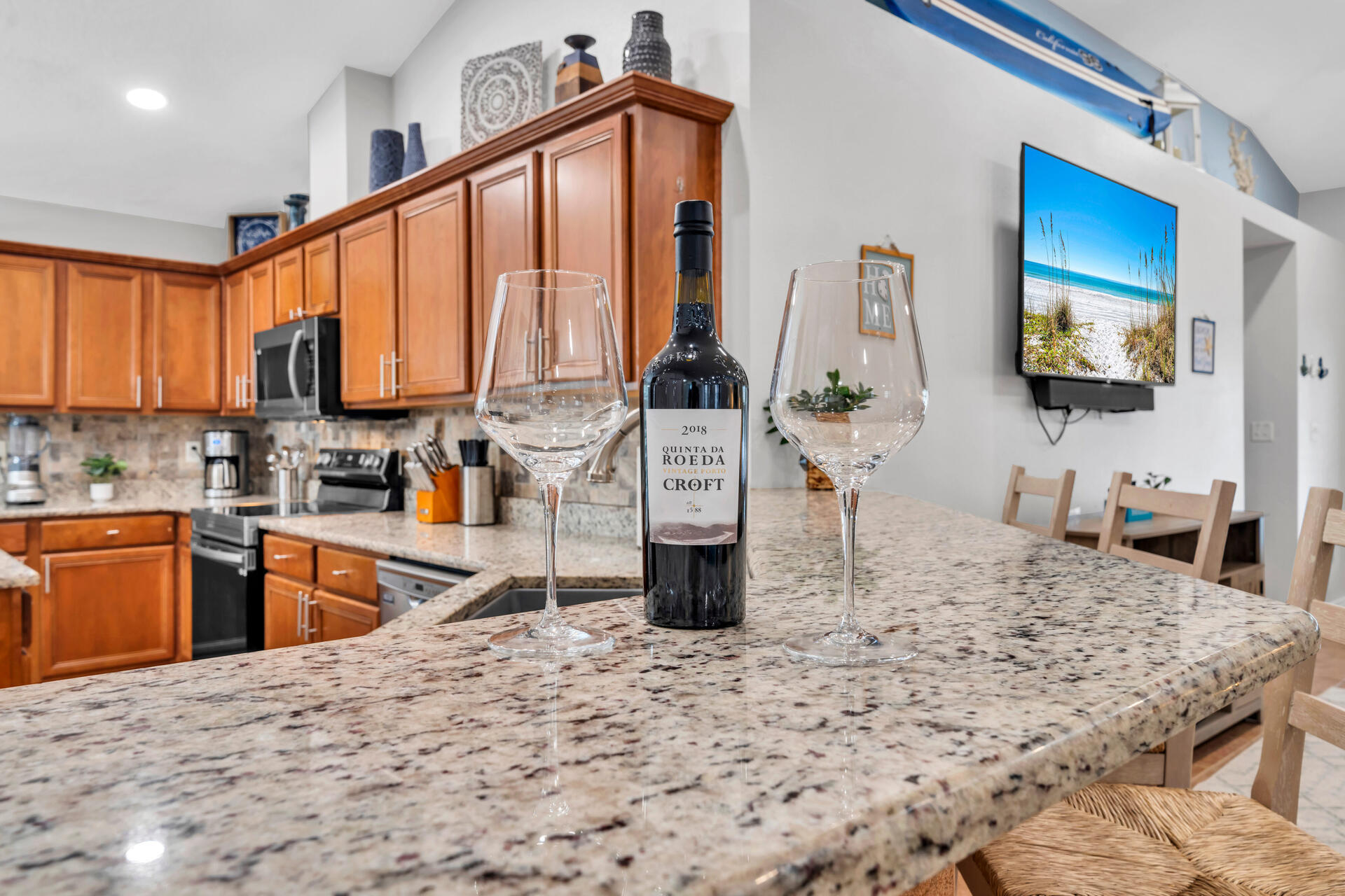 261 Sandy Cay Drive Miramar Beach, FL 32550 - Photo 15 of 72 a kitchen with stainless steel appliances kitchen island granite countertop a stove a sink and a microwave