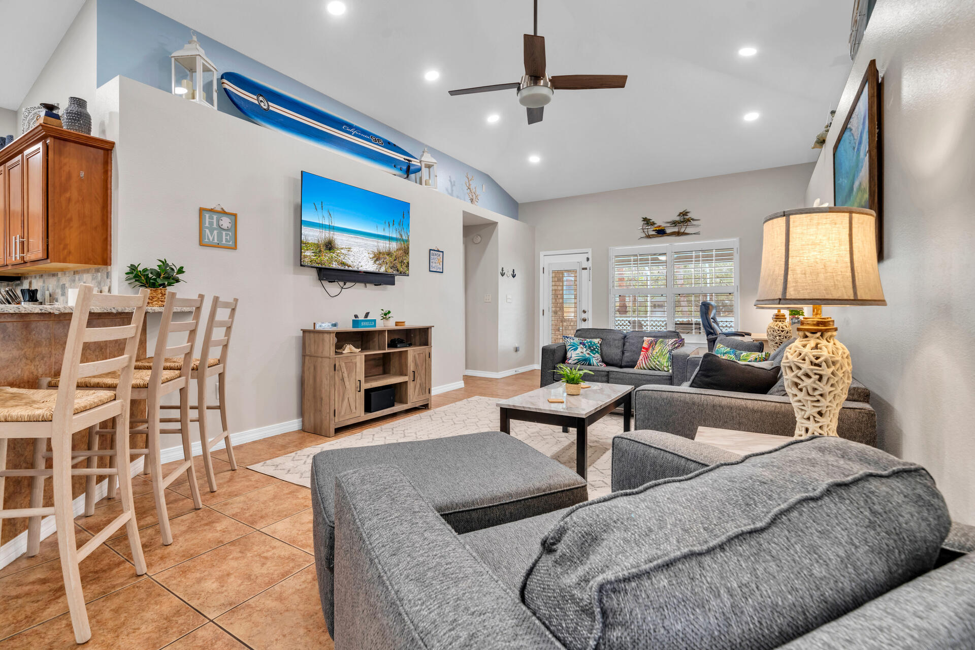 261 Sandy Cay Drive Miramar Beach, FL 32550 - Photo 24 of 72 a living room with furniture a flat screen tv and kitchen view