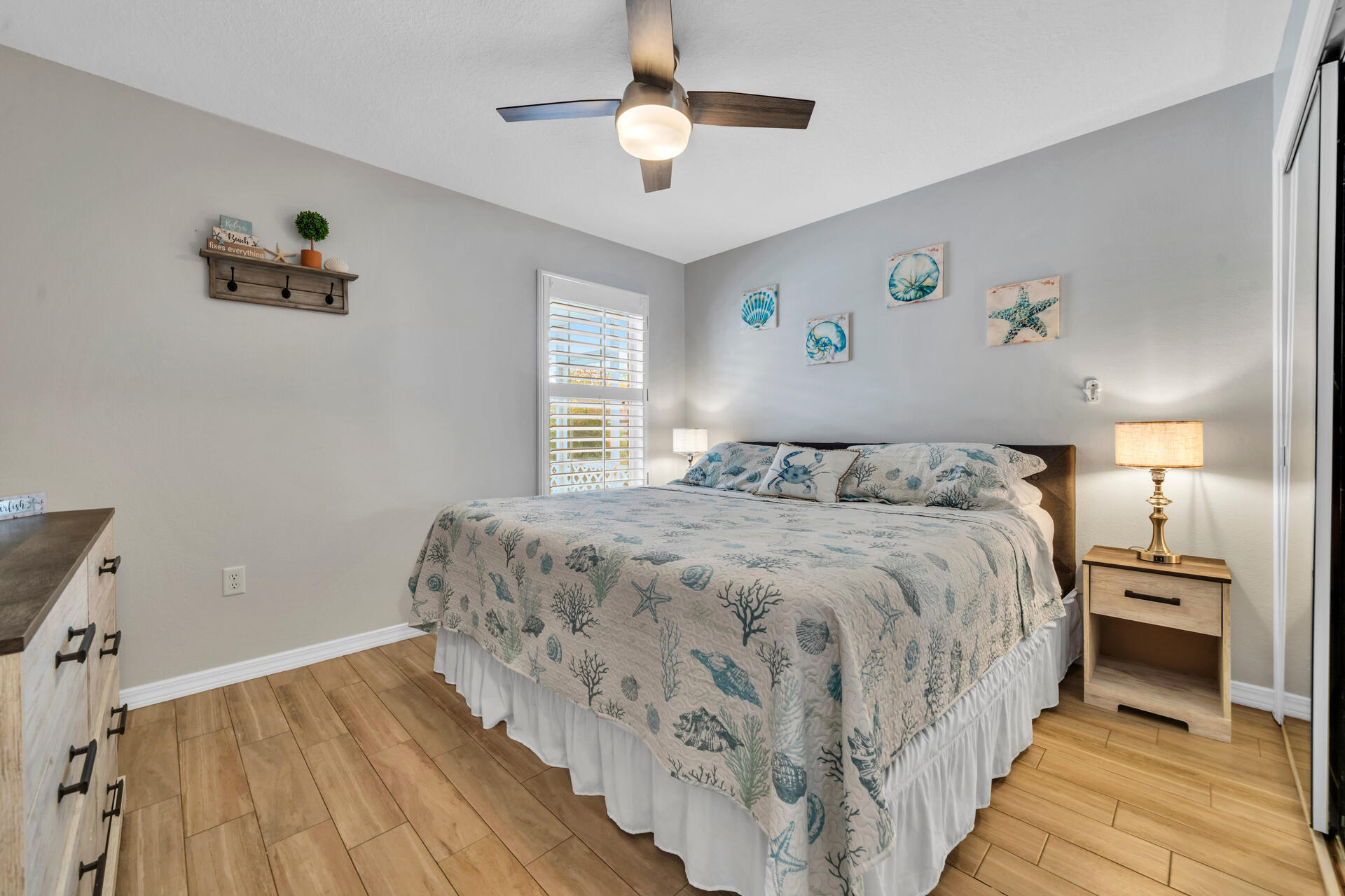 261 Sandy Cay Drive Miramar Beach, FL 32550 - Photo 34 of 72 a bedroom with a bed and a chandelier