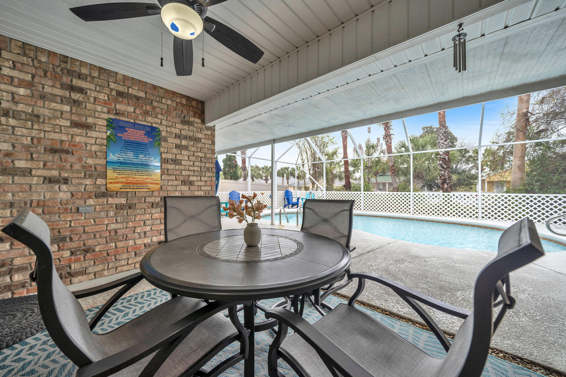 261 Sandy Cay Drive Miramar Beach, FL 32550 - Photo 42 of 72 a view of a dining room with furniture wooden floor and chandelier
