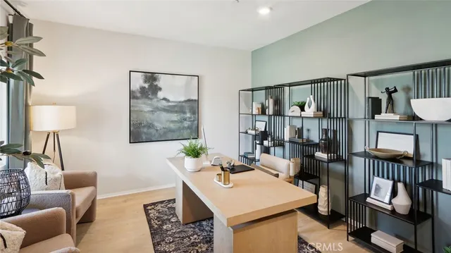 a living room with furniture a rug and a window