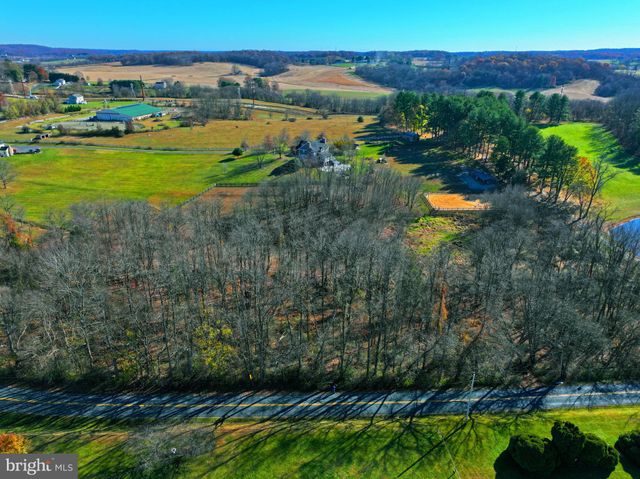 a view of a lake with a building in the background