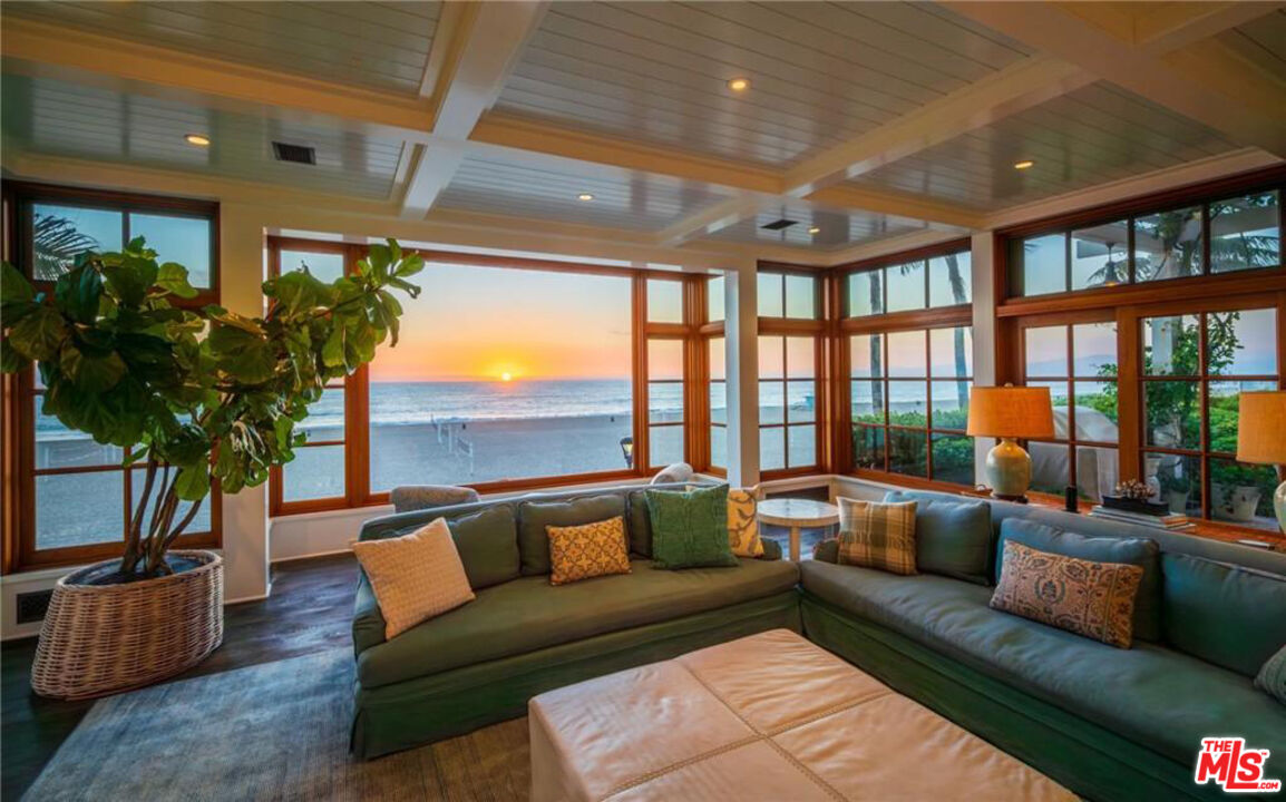 212 The Strand Manhattan Beach, CA 90266 - Photo 12 of 74 a living room with furniture and a large window