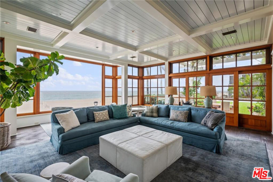 212 The Strand Manhattan Beach, CA 90266 - Photo 14 of 74 a living room with furniture and a large window