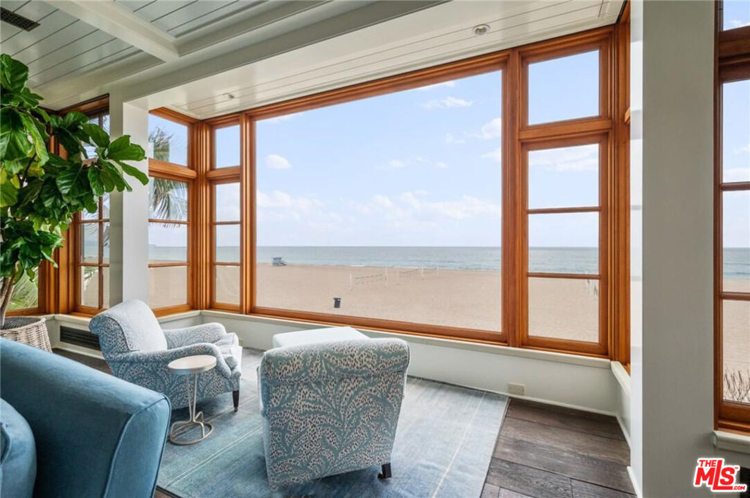 212 The Strand Manhattan Beach, CA 90266 - Photo 15 of 74 a living room with furniture and a large window
