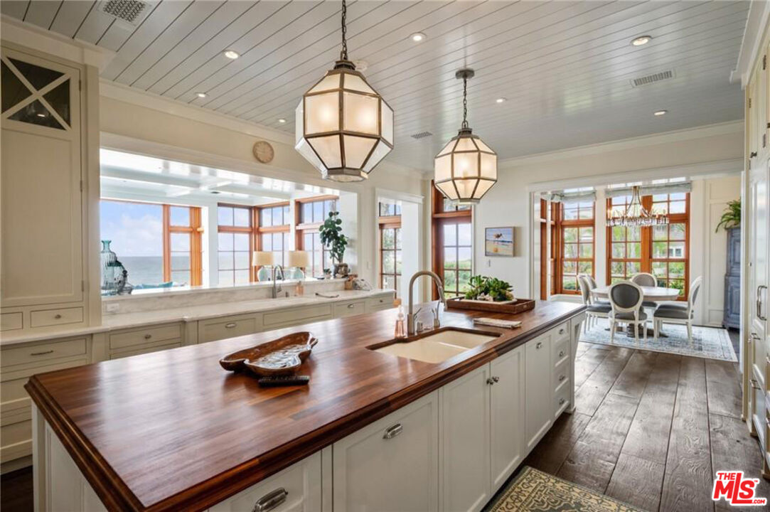 212 The Strand Manhattan Beach, CA 90266 - Photo 16 of 74 a very nice looking kitchen with granite countertop a large window