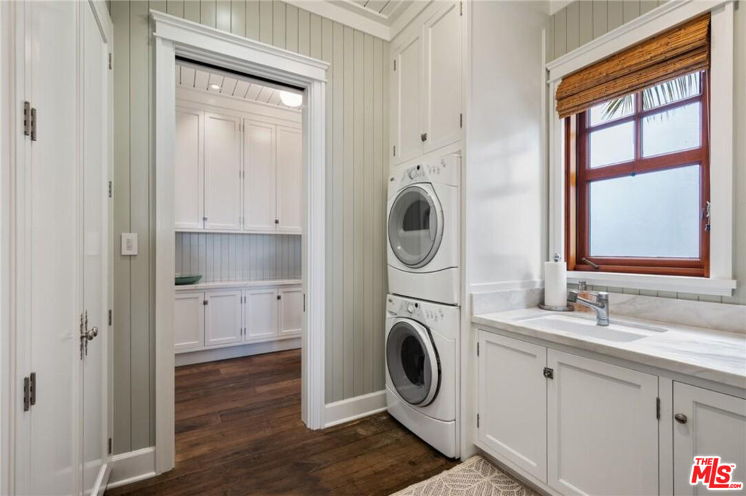 212 The Strand Manhattan Beach, CA 90266 - Photo 20 of 74 a bathroom with a sink a washer and dryer