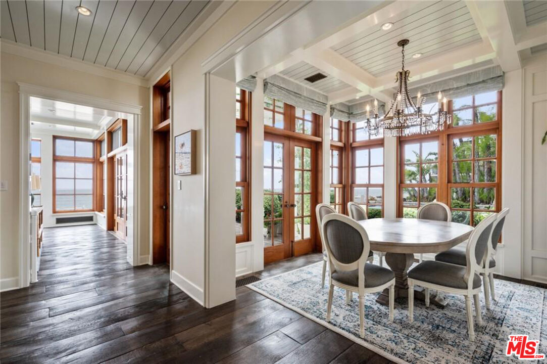 212 The Strand Manhattan Beach, CA 90266 - Photo 23 of 74 a dining room with furniture a chandelier and wooden floor