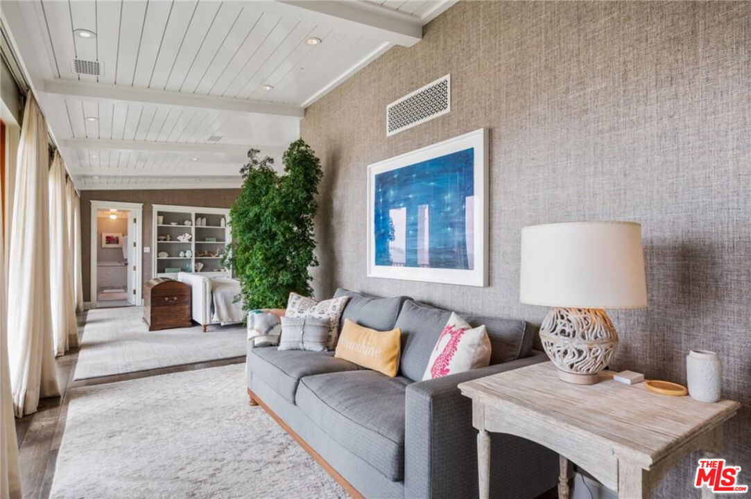 212 The Strand Manhattan Beach, CA 90266 - Photo 37 of 74 a living room with furniture and a potted plant
