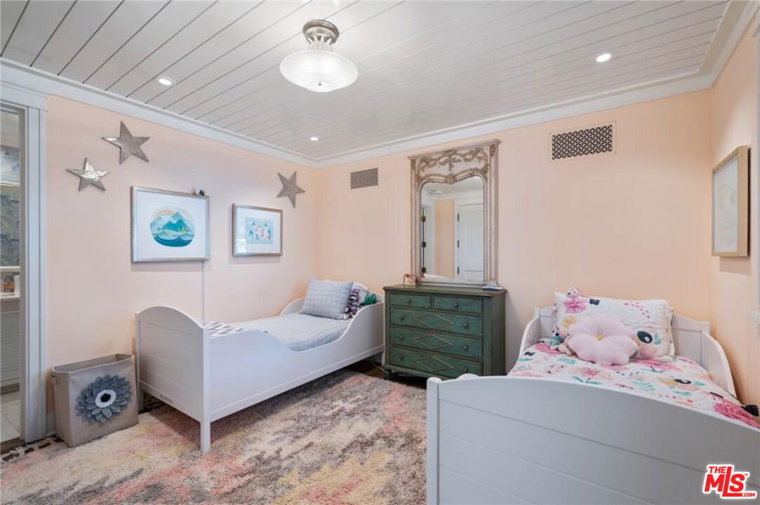 212 The Strand Manhattan Beach, CA 90266 - Photo 45 of 74 a bedroom with furniture and a window