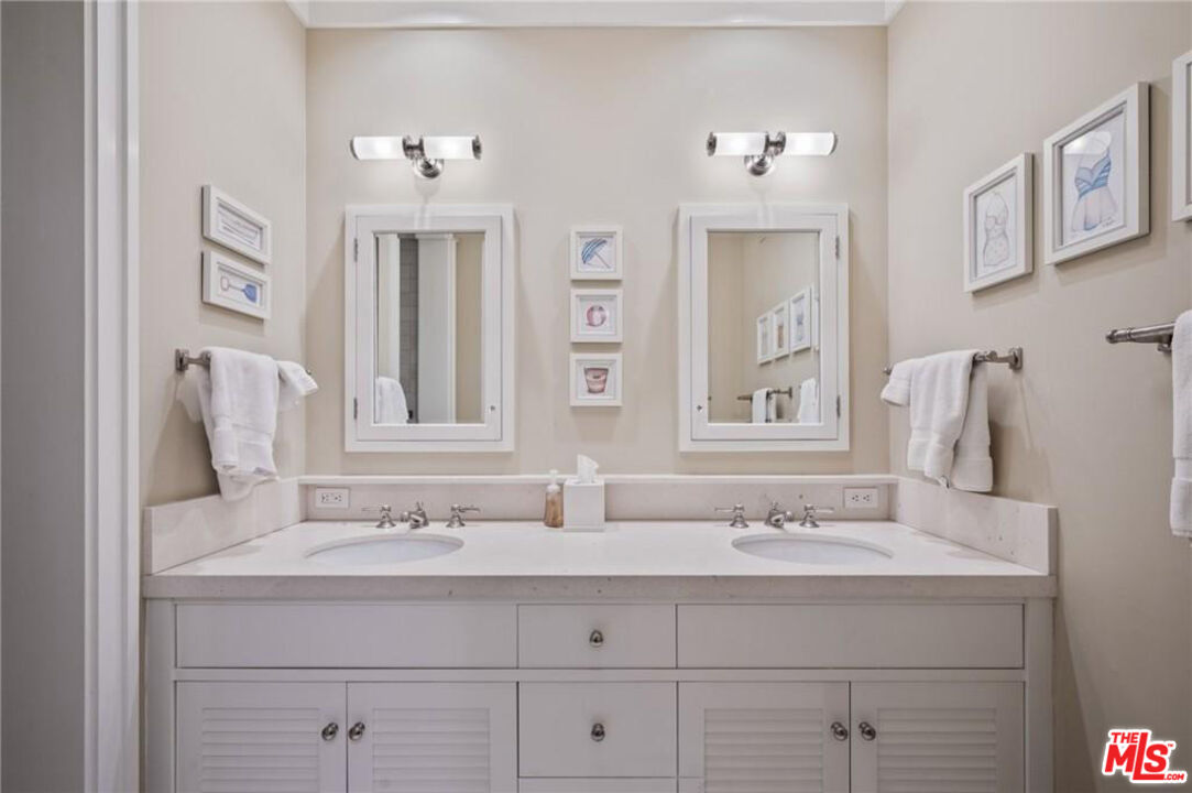 212 The Strand Manhattan Beach, CA 90266 - Photo 47 of 74 a bathroom with a sink and a mirror