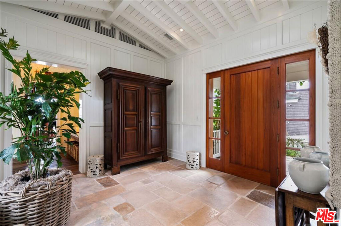 212 The Strand Manhattan Beach, CA 90266 - Photo 5 of 74 a view of an entryway with a door and chair