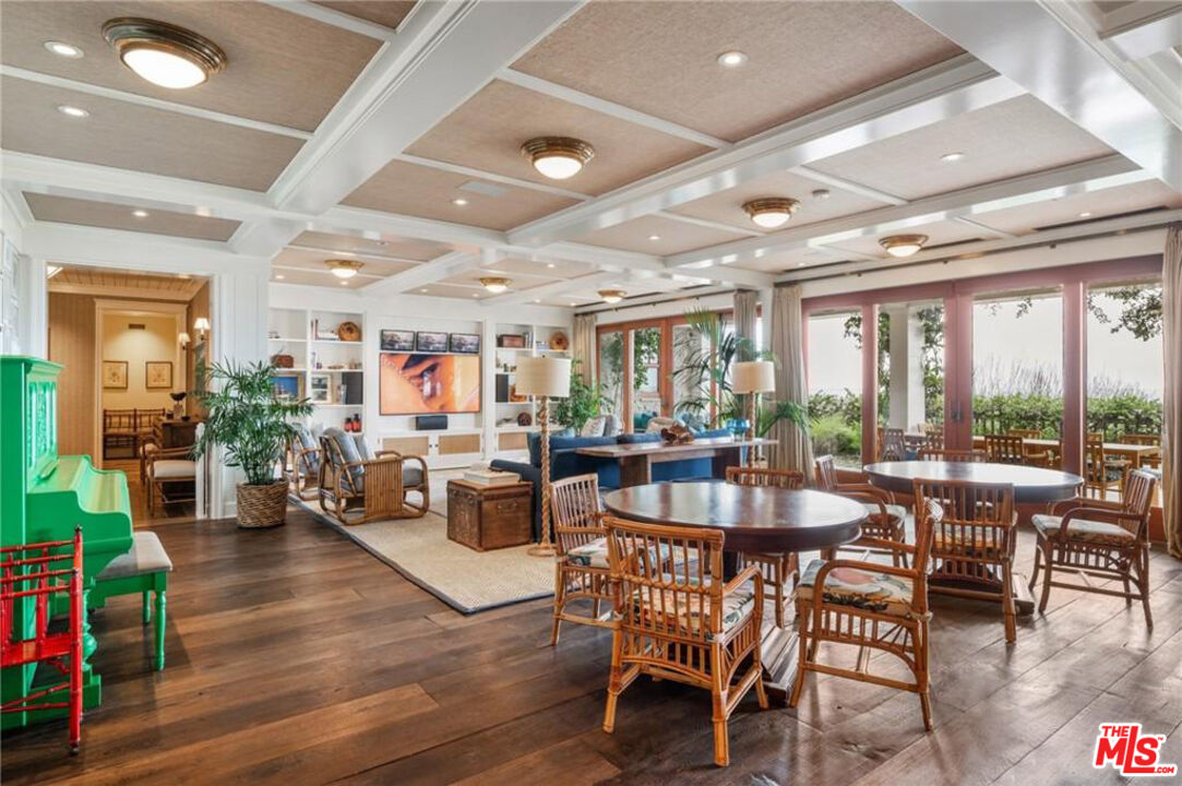 212 The Strand Manhattan Beach, CA 90266 - Photo 55 of 74 a view of a dining room with furniture window and wooden floor