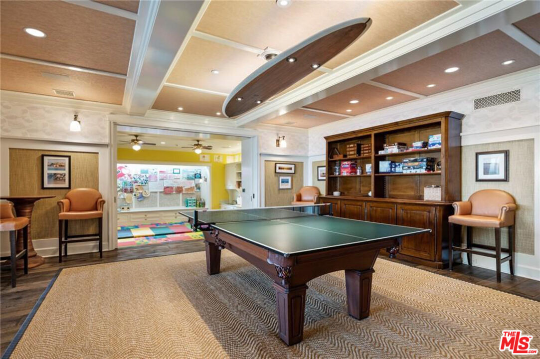 212 The Strand Manhattan Beach, CA 90266 - Photo 60 of 74 a living room with furniture a table and a flat screen tv